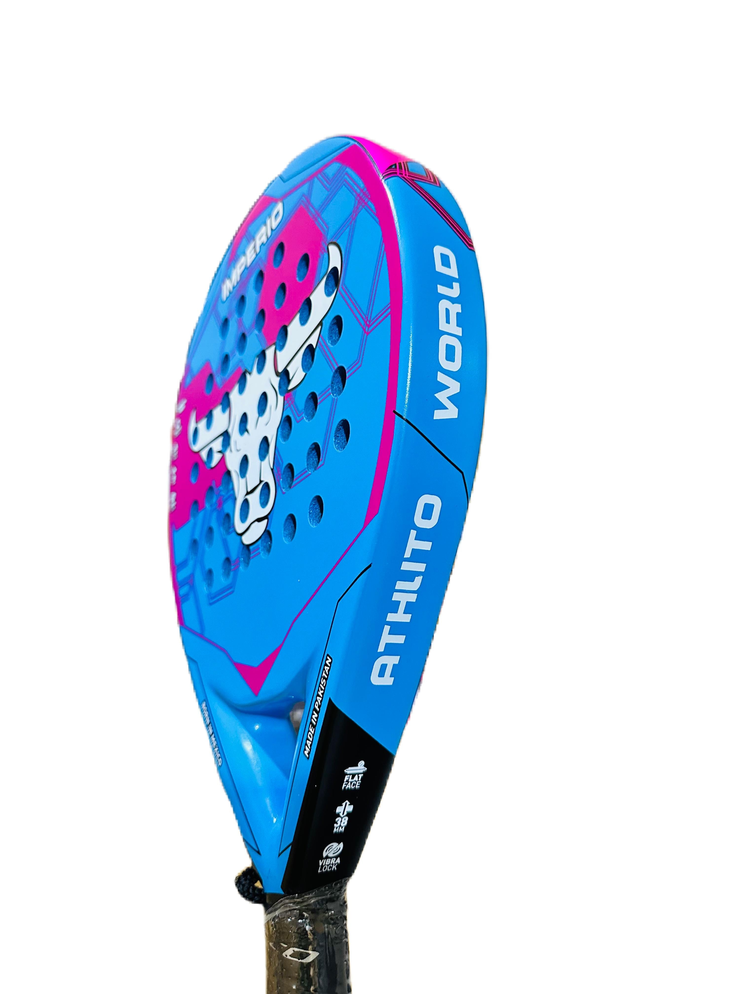 A close-up side view of a blue and pink padel racket head with white and black details, on a solid white background.