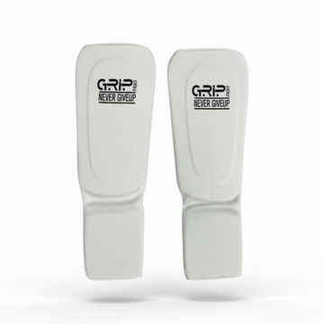 Grip Fight white foam elastic shin and instep guards for martial arts sparring⁠